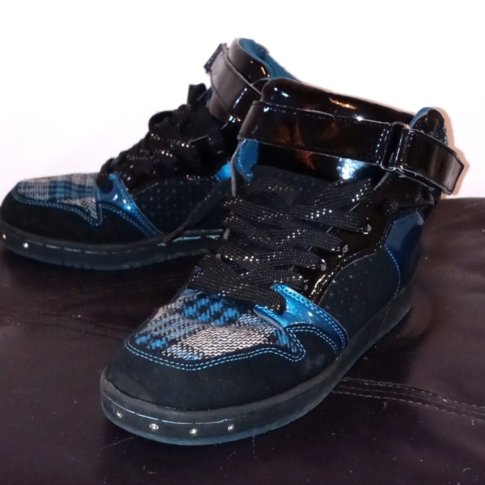 Blue black and gray high top sneaker with diamonds embedded on the front of shoe